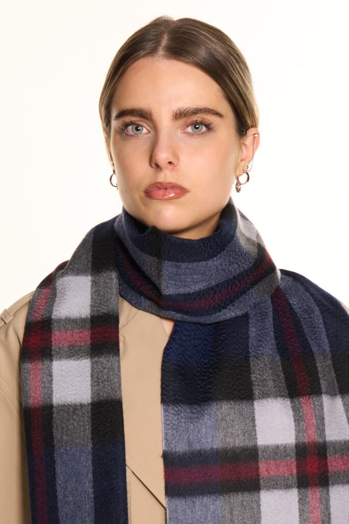 A close-up of the delicate work on a charcoal cashmere scarf